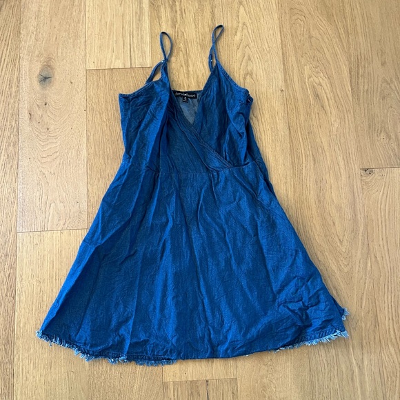 Women’s size S denim mini dress with fringe detail and zipper back. - Picture 2 of 3